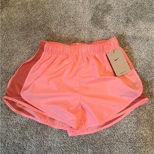 New with tags pink Nike running shirts size small